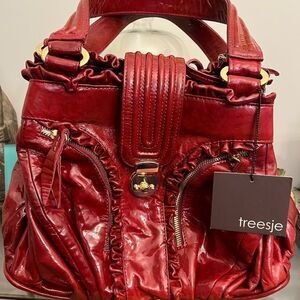 NWT Tressje Gorgeous Red Patent Leather handbag.